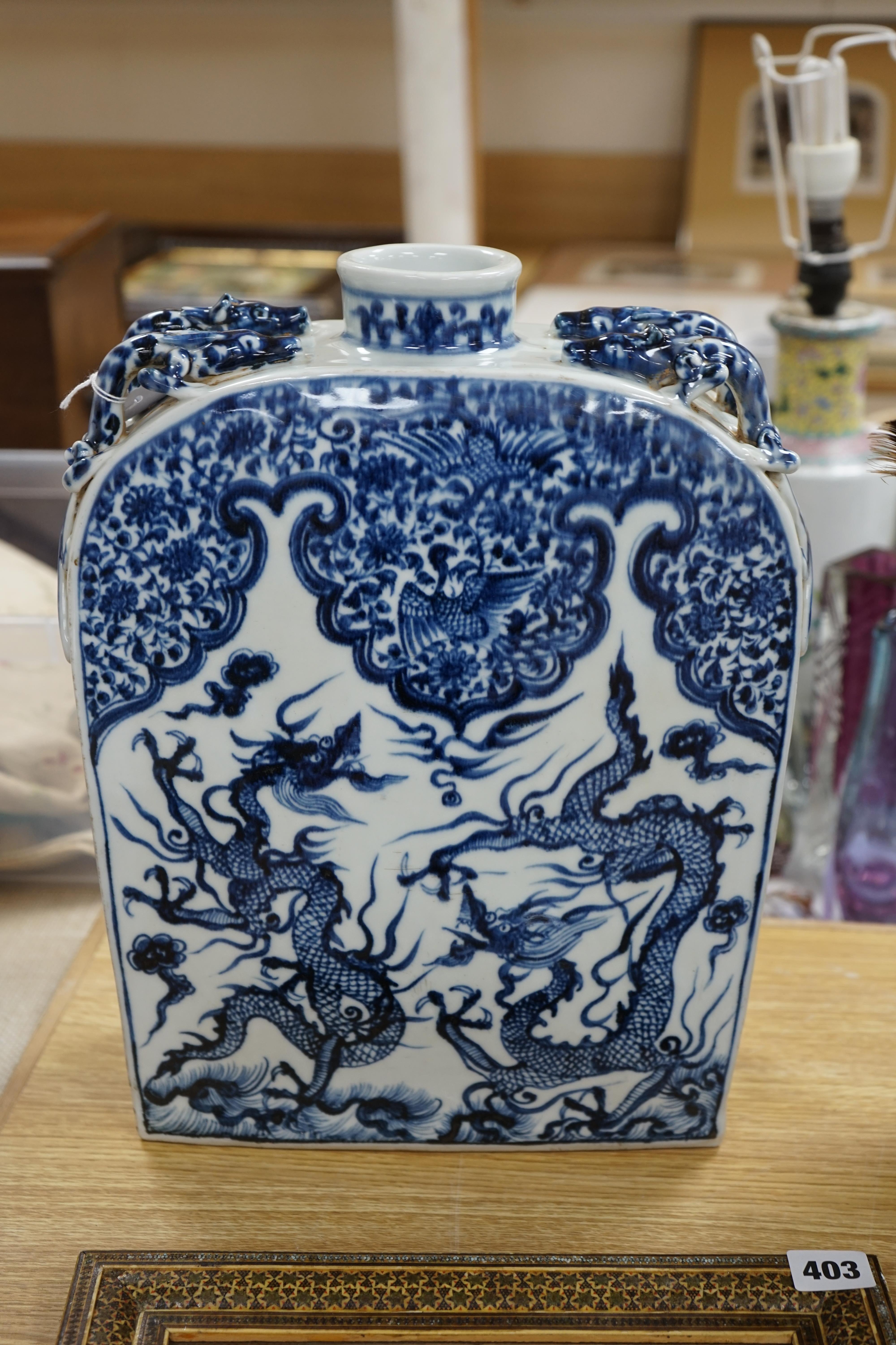 A large Chinese blue and white dragon flask, 39cm high. Condition - good